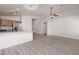 An open kitchen featuring stainless steel appliances, a ceiling fan, and modern lighting at 5049 Running Rapids Ave, Las Vegas, NV 89130