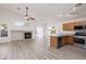 Open-concept living area with modern kitchen, granite counters and bright living space at 5049 Running Rapids Ave, Las Vegas, NV 89130