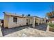 The back of the home has a covered patio and a geometrically-patterned concrete area at 5121 Gains Mill St, Las Vegas, NV 89122
