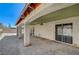 Back of the home with sliding glass doors leading to a spacious, covered outdoor patio at 5121 Gains Mill St, Las Vegas, NV 89122