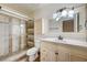 Tiled bathroom with glass shower, vanity with marble top, and modern fixtures at 5121 Gains Mill St, Las Vegas, NV 89122
