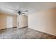 Bright bedroom with unique tile flooring, ceiling fan, and access to a bathroom at 5121 Gains Mill St, Las Vegas, NV 89122