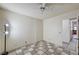 View of a bedroom featuring checkered flooring and a ceiling fan at 5121 Gains Mill St, Las Vegas, NV 89122