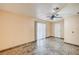 Bedroom with tile floors, sliding glass doors, and overhead ceiling fan at 5121 Gains Mill St, Las Vegas, NV 89122