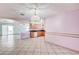Open floor plan featuring tile flooring, kitchen access, and natural light at 5121 Gains Mill St, Las Vegas, NV 89122
