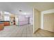 Open-concept area featuring tile floors, access to the kitchen and entry way at 5121 Gains Mill St, Las Vegas, NV 89122