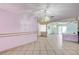 Living room area offering an open floor plan with tile flooring and natural light at 5121 Gains Mill St, Las Vegas, NV 89122