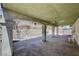 Large covered outdoor patio with decorative concrete pillars and overhead lighting fixtures at 5121 Gains Mill St, Las Vegas, NV 89122