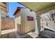 A storage shed on a concrete patio and adjacent to the home's covered outdoor area at 5121 Gains Mill St, Las Vegas, NV 89122