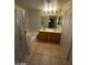 Well-lit bathroom with tile floors, a double sink vanity and walk-in shower at 5413 Bristol Bend Ct, Las Vegas, NV 89135
