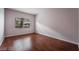 Bedroom featuring wood floors and a window that allows natural light at 5415 W Harmon Ave # 1162, Las Vegas, NV 89103