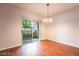 Bright dining area with wood floors and sliding door to a balcony with a view at 5415 W Harmon Ave # 1162, Las Vegas, NV 89103