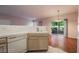 Kitchen with a white dishwasher and wooden cabinets at 5415 W Harmon Ave # 1162, Las Vegas, NV 89103
