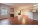 Bright living room with wood floors, fireplace, and sliding glass door to balcony at 5415 W Harmon Ave # 1162, Las Vegas, NV 89103