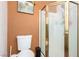 Bathroom featuring a stand up shower with bronze framing, and a modern comfort height toilet at 5424 Geneive Ln # 105, Las Vegas, NV 89108