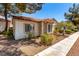 Charming single-story home with a terracotta roof, bay windows, and xeriscaped landscaping at 5424 Geneive Ln # 105, Las Vegas, NV 89108
