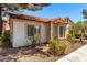 Charming single-story home with a terracotta roof, bay windows, and xeriscaped landscaping at 5424 Geneive Ln # 105, Las Vegas, NV 89108