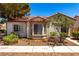 Charming single-story home with a terracotta roof, bay windows, and xeriscaped landscaping at 5424 Geneive Ln # 105, Las Vegas, NV 89108