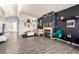 Spacious living room with a fireplace, laminate floors, and art-filled walls at 5424 Geneive Ln # 105, Las Vegas, NV 89108