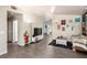 Open-concept living room with laminate flooring, neutral walls, and an airy feel at 5424 Geneive Ln # 105, Las Vegas, NV 89108