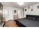 Cozy bedroom featuring hardwood floors, a bed, and two closets offering a comfortable retreat at 5424 Geneive Ln # 105, Las Vegas, NV 89108