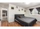 Comfortable bedroom featuring hardwood floors, a bed, and a large window offering a comfortable retreat at 5424 Geneive Ln # 105, Las Vegas, NV 89108
