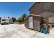 Backyard with a shed, RV parking, and a glimpse of the well-maintained landscaping beyond the fence at 6109 Sandstone Mesa Dr, Las Vegas, NV 89130
