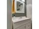 Clean bathroom with a white vanity, modern mirror, and fresh decor at 6109 Sandstone Mesa Dr, Las Vegas, NV 89130