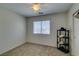 Bedroom with a window, ceiling fan and carpet at 6109 Sandstone Mesa Dr, Las Vegas, NV 89130