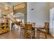View of the dining area with stairs and wooden table, showcasing a cohesive design aesthetic at 6109 Sandstone Mesa Dr, Las Vegas, NV 89130