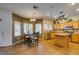 Open kitchen with ample countertop space, stainless steel appliances, and adjacent dining area, perfect for entertaining at 6109 Sandstone Mesa Dr, Las Vegas, NV 89130
