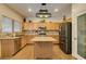 Well-equipped kitchen with a center island, stainless steel appliances, and custom cabinetry, offering style and functionality at 6109 Sandstone Mesa Dr, Las Vegas, NV 89130