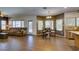 Spacious living room with wood-look floors, comfortable seating, and natural light, ideal for relaxation at 6109 Sandstone Mesa Dr, Las Vegas, NV 89130