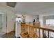 Bright loft area features wood floors, a ceiling fan, and railing overlooking living space at 6109 Sandstone Mesa Dr, Las Vegas, NV 89130