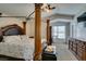Spacious main bedroom with four-poster bed, carpet, and plenty of natural light at 6109 Sandstone Mesa Dr, Las Vegas, NV 89130