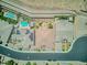 An aerial view of a desert property with pools, gardens, and large yards at 6315 Carol Butte Ct, Las Vegas, NV 89141