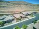 Aerial view of desert homes showcasing tile roofs and desert landscaping at 6315 Carol Butte Ct, Las Vegas, NV 89141