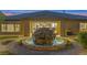 The rear exterior shows a water fountain with landscaped features and covered patio space at 6315 Carol Butte Ct, Las Vegas, NV 89141