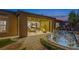 Charming backyard features covered patio, stone water feature, and manicured landscaping at 6315 Carol Butte Ct, Las Vegas, NV 89141