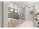 Bathroom with a spacious walk-in shower, soaking tub, and modern fixtures at 6315 Carol Butte Ct, Las Vegas, NV 89141