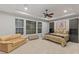 Bedroom with seating, large window, and ceiling fan at 6315 Carol Butte Ct, Las Vegas, NV 89141