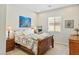 Comfortable bedroom with a wooden bed frame and cozy decor at 6315 Carol Butte Ct, Las Vegas, NV 89141