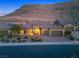 Stunning home features desert landscaping, a courtyard, and three-car garage at 6315 Carol Butte Ct, Las Vegas, NV 89141