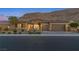 Beautiful single-story home with a tile roof, landscaped front yard, and a spacious three-car garage at 6315 Carol Butte Ct, Las Vegas, NV 89141