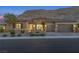 Inviting single-story home with desert landscaping, a courtyard and three-car garage at 6315 Carol Butte Ct, Las Vegas, NV 89141