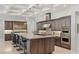 Spacious kitchen features a large island, stainless appliances and designer lighting at 6315 Carol Butte Ct, Las Vegas, NV 89141