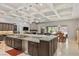 Gourmet kitchen features a large island, designer lighting, and granite counters at 6315 Carol Butte Ct, Las Vegas, NV 89141
