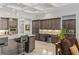 Kitchen featuring granite counters, large island and grey cabinets at 6315 Carol Butte Ct, Las Vegas, NV 89141
