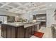 Gourmet kitchen with large island, stainless steel appliances, and granite counters at 6315 Carol Butte Ct, Las Vegas, NV 89141