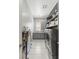 Laundry room featuring ample counter space, stainless steel appliances, and cabinet storage at 6315 Carol Butte Ct, Las Vegas, NV 89141